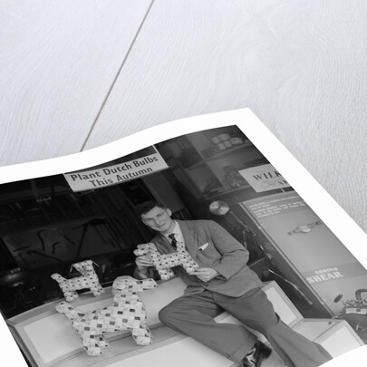 'Chap with Cigarette Packet Dogs' by Manx Press Pictures