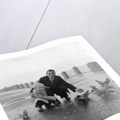 Feeding pigeons on Douglas Promenade by Manx Press Pictures