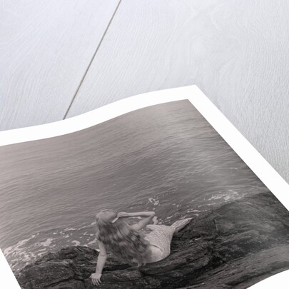 Mermaid on the rocks at Port Soderick by Manx Press Pictures