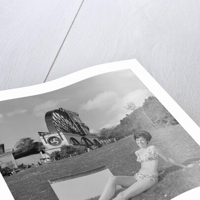 Woman in bikini advertising portable electric heater, Laxey Wheel by Manx Press Pictures