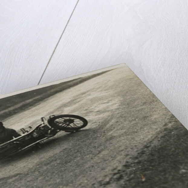 Rider A.J. Robertson on the ground, with his machine laid down on the road beside him, 1925 or 1926 (?) TT (Tourist Trophy) by Thomas Horsfell Midwood
