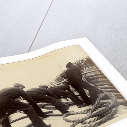 Sailors putting rope on a steamer by Anonymous