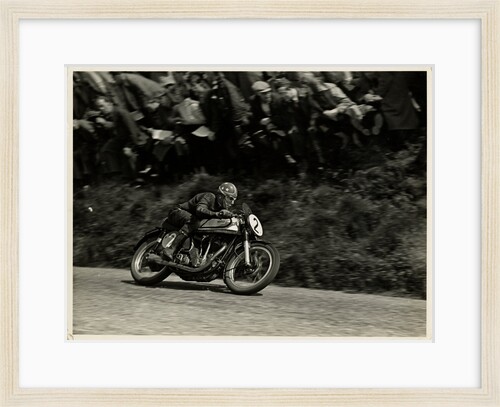 Nick Nicholson riding Norton number 2, Kate's Cottage, 1953 Senior TT (Tourist Trophy) by T.M. Badger