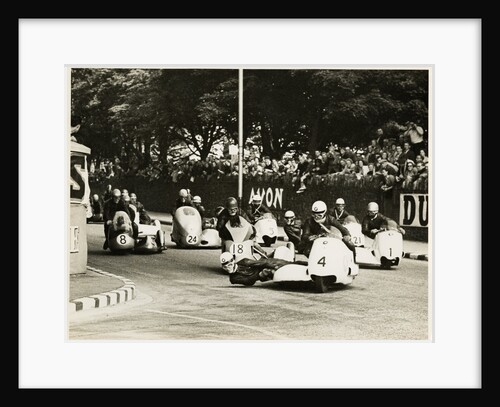 L. Neusser, driving a BMW sidecar outfit leads the field around Parkfield Corner, following the mass start of the1958 Sidecar TT by T.M. Badger