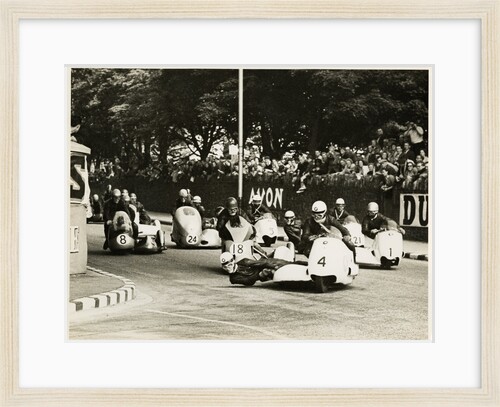 L. Neusser, driving a BMW sidecar outfit leads the field around Parkfield Corner, following the mass start of the1958 Sidecar TT by T.M. Badger