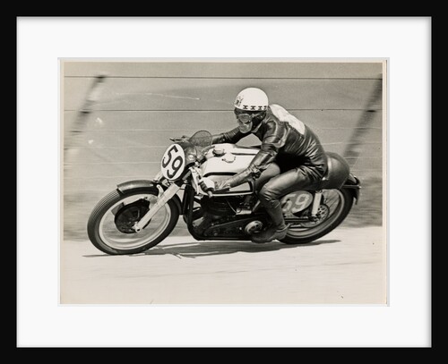 Ray Amm, TT (Tourist Trophy) rider, riding a Norton (number 59) by T.M. Badger