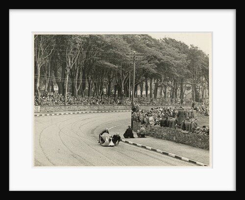TT (Tourist Trophy) sidecar outfit (number 20) at Nursery Bends (?) by T.M. Badger