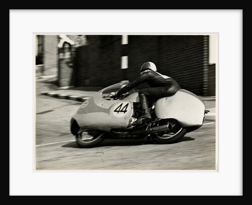 TT (Tourist Trophy) rider number 44, cornering at the Manx Arms (?) by T.M. Badger