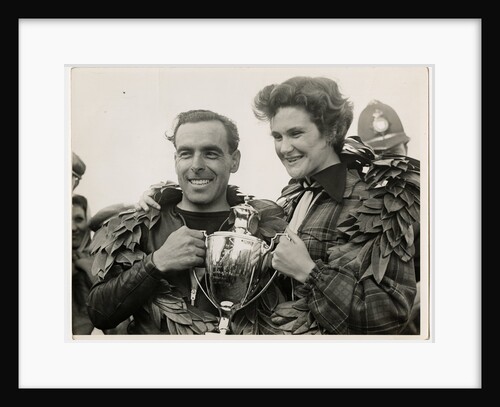Sidercar TT (Tourist Trophy) crew holding a silver cup by T.M. Badger