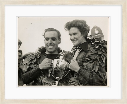 Sidercar TT (Tourist Trophy) crew holding a silver cup by T.M. Badger