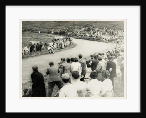 TT (Tourist Trophy) rider number 1 passes large crowd on the Mountain by T.M. Badger
