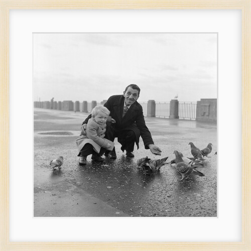 Feeding pigeons on Douglas Promenade by Manx Press Pictures