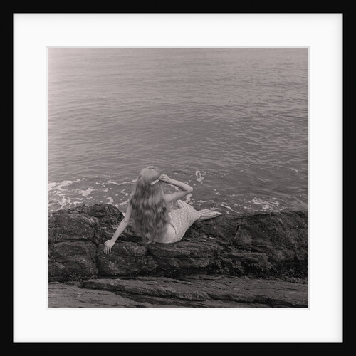 Mermaid on the rocks at Port Soderick by Manx Press Pictures