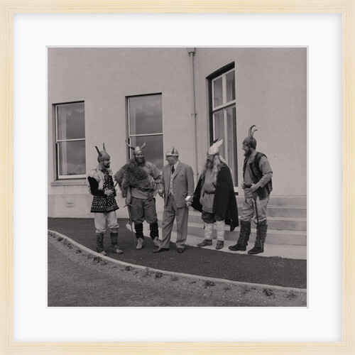 Lieutenant Governor Sir Ronald Herbert Garvey given a Viking helmet by Manx Press Pictures