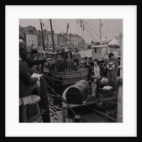 Radio Caroline disc jockeys Tony Prince and Dave Lee Travis on boat, East Quay, Ramsey Harbour by Manx Press Pictures