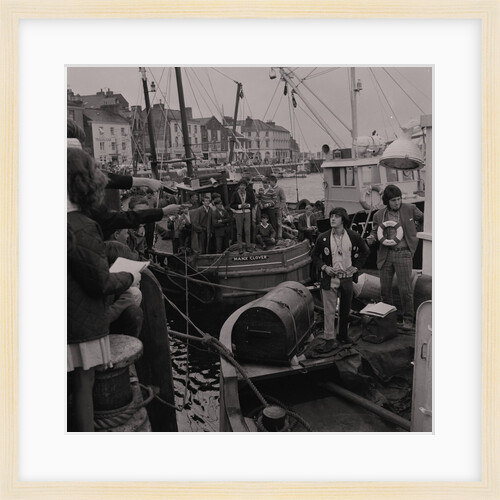 Radio Caroline disc jockeys Tony Prince and Dave Lee Travis on boat, East Quay, Ramsey Harbour by Manx Press Pictures