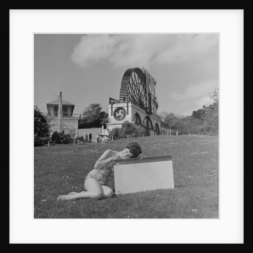 Woman in bikini advertising portable electric heater, Laxey Wheel by Manx Press Pictures