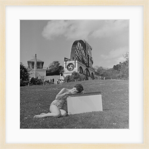 Woman in bikini advertising portable electric heater, Laxey Wheel by Manx Press Pictures