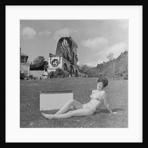 Woman in bikini advertising portable electric heater, Laxey Wheel by Manx Press Pictures
