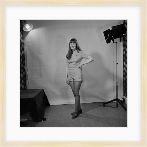 Woman in hot pants in studio, Isle of Man by Manx Press Pictures