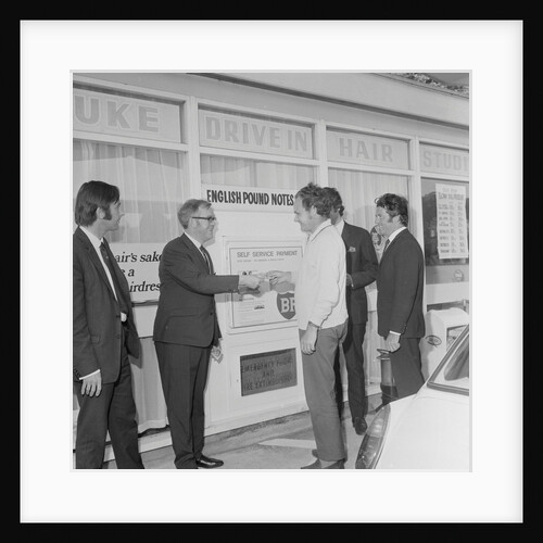 Geoff Duke at petrol station auto pay kiosk by Manx Press Pictures