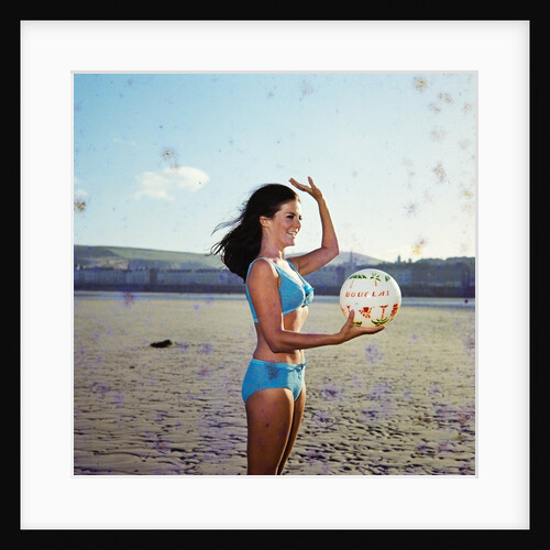 Glamour girl on Douglas beach with beachball by Manx Press Pictures