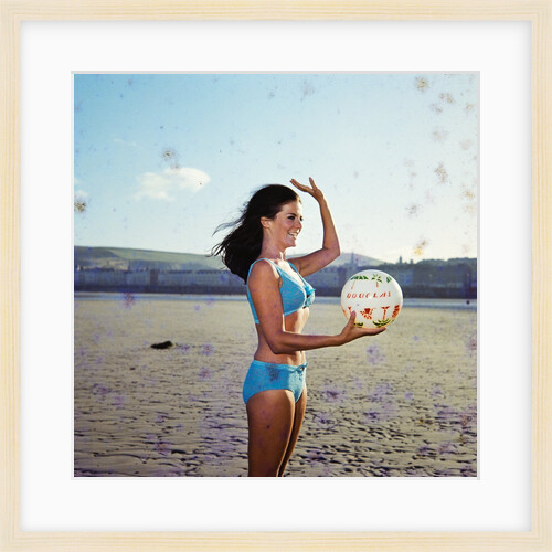 Glamour girl on Douglas beach with beachball by Manx Press Pictures