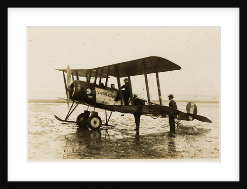 Plane No. 9 on the shore at Ramsey belonging to A.V. Roe and Co. Ltd. G.W. Kewin, town surveyor climbing into the cockpit by Thomas Horsfell Midwood