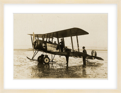 Plane No. 9 on the shore at Ramsey belonging to A.V. Roe and Co. Ltd. G.W. Kewin, town surveyor climbing into the cockpit by Thomas Horsfell Midwood