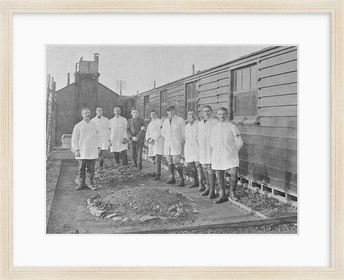 First World War Internee in front of hut with medical/hospital staff, Camp 2, Knockaloe by W H Warburton