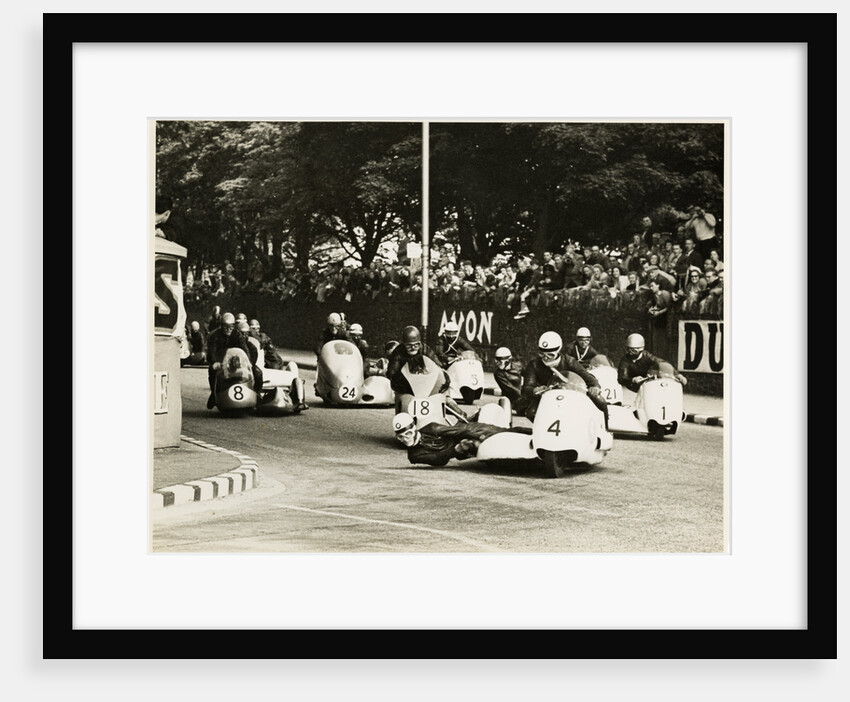 L. Neusser, driving a BMW sidecar outfit leads the field around Parkfield Corner, following the mass start of the1958 Sidecar TT by T.M. Badger