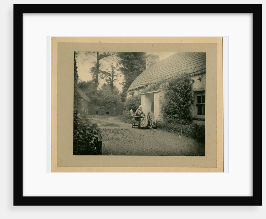 Margaret Lace (known as 'Mother Lace') spinning outside her cottage by George Bellett Cowen