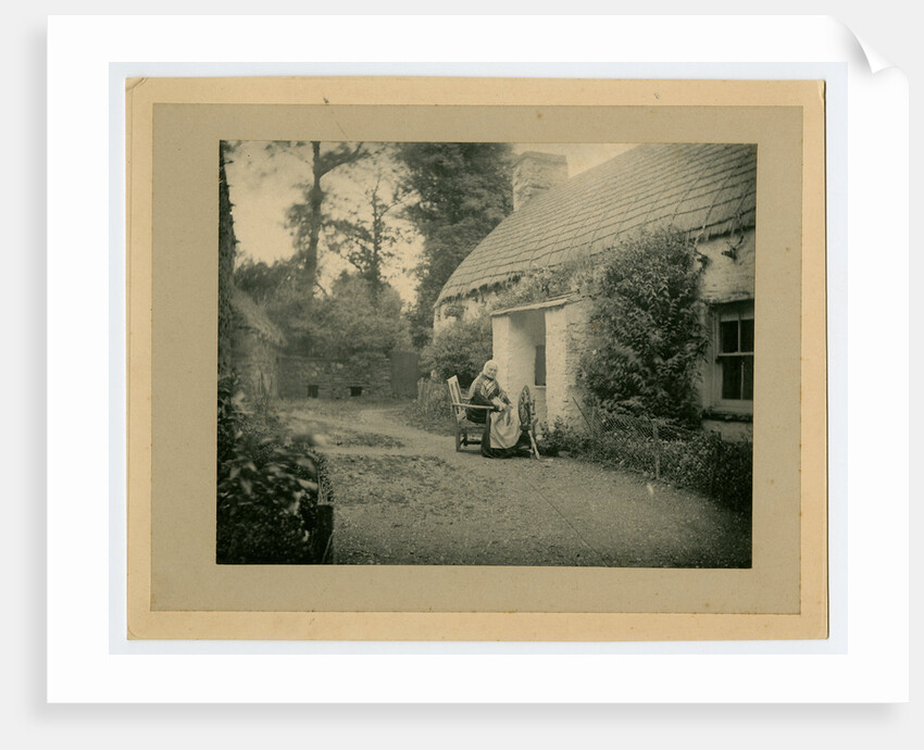 Margaret Lace (known as 'Mother Lace') spinning outside her cottage by George Bellett Cowen