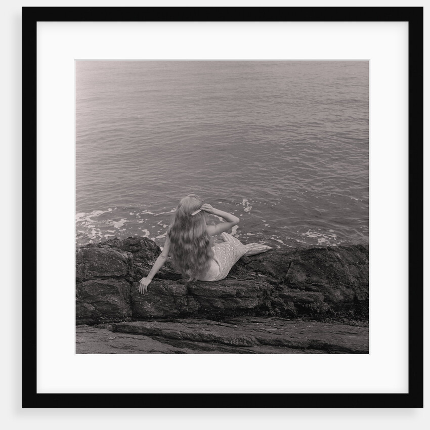 Mermaid on the rocks at Port Soderick by Manx Press Pictures