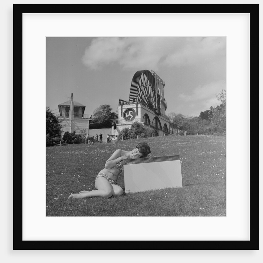 Woman in bikini advertising portable electric heater, Laxey Wheel by Manx Press Pictures