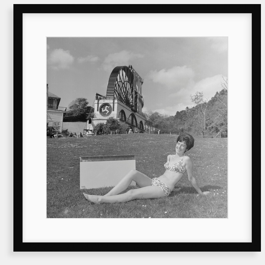 Woman in bikini advertising portable electric heater, Laxey Wheel by Manx Press Pictures