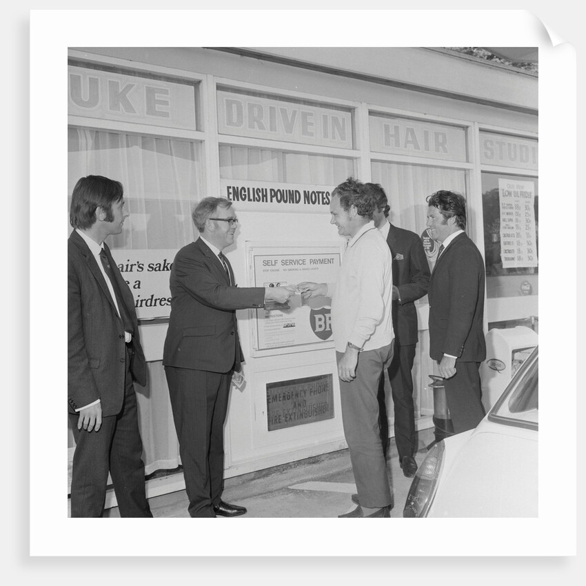 Geoff Duke at petrol station auto pay kiosk by Manx Press Pictures