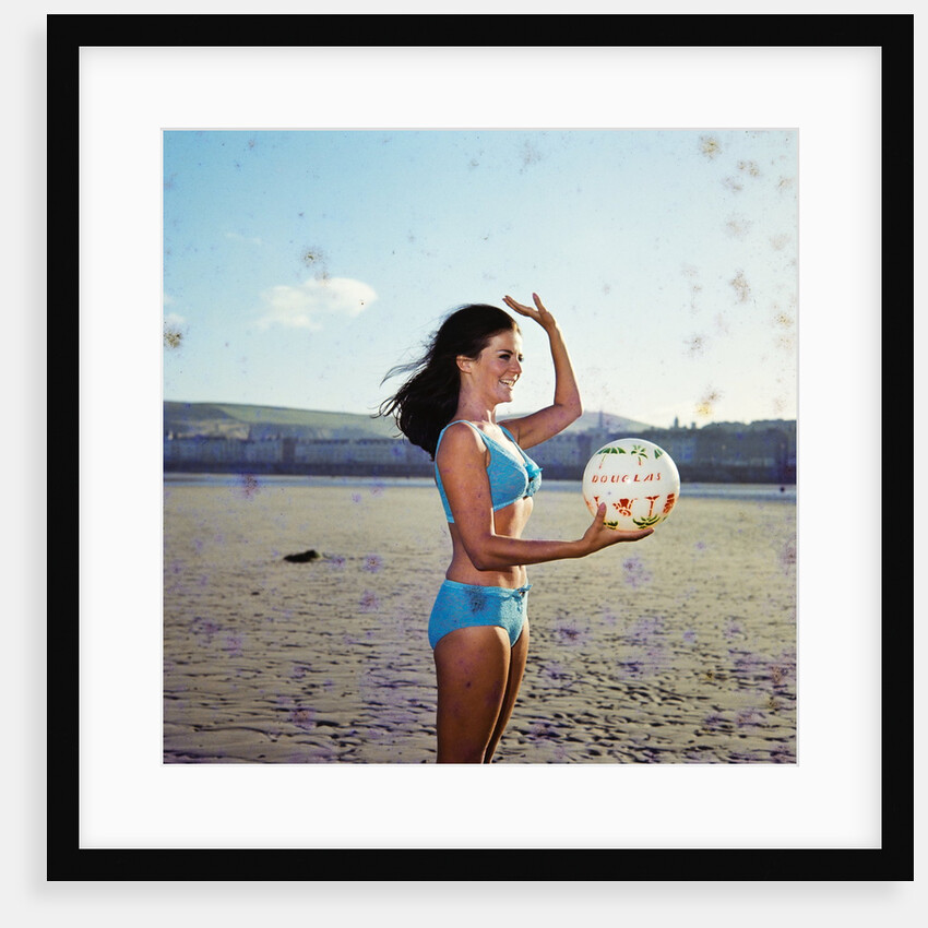 Glamour girl on Douglas beach with beachball by Manx Press Pictures