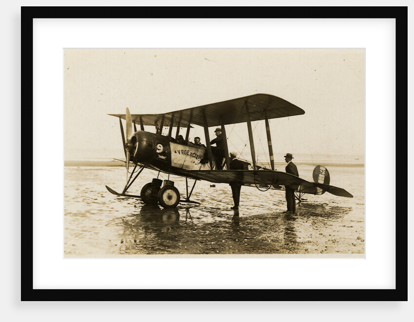 Plane No. 9 on the shore at Ramsey belonging to A.V. Roe and Co. Ltd. G.W. Kewin, town surveyor climbing into the cockpit by Thomas Horsfell Midwood