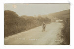 Rider passing along Kirk Michael to Peel coast road, captioned ‘C.R.Collier, winner of the motorcycle race’, likely to be 1907 TT (Tourist Trophy) by Anonymous