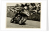 John Surtees riding as number 81 at Kate's Cottage, 1956 Senior TT (Tourist Trophy) by T.M. Badger