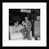'Chap with Cigarette Packet Dogs' by Manx Press Pictures