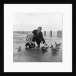 Feeding pigeons on Douglas Promenade by Manx Press Pictures