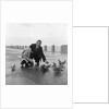 Feeding pigeons on Douglas Promenade by Manx Press Pictures