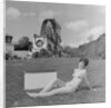 Woman in bikini advertising portable electric heater, Laxey Wheel by Manx Press Pictures