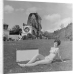 Woman in bikini advertising portable electric heater, Laxey Wheel by Manx Press Pictures