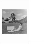 Woman in bikini advertising portable electric heater, Laxey Wheel by Manx Press Pictures