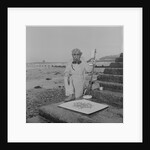 Metal detectorist on Douglas beach by Manx Press Pictures