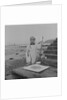 Metal detectorist on Douglas beach by Manx Press Pictures