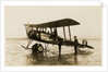 Plane No. 9 on the shore at Ramsey belonging to A.V. Roe and Co. Ltd. G.W. Kewin, town surveyor climbing into the cockpit by Thomas Horsfell Midwood